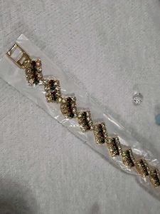 Elegant Gold Finish Bracelet with Multicolour Ston