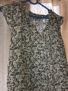 green printed Top with Leavy-flower Print on it.