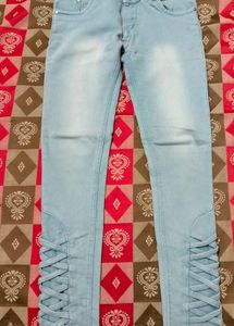 Light Blue Jeans With Criss Cross Design