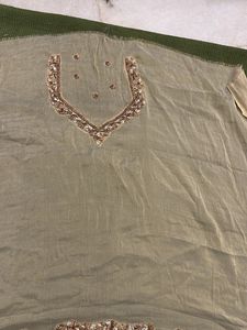 designer blouse piece in soft gold with hand work