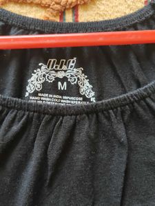 Chic Black Top with Bow Detail