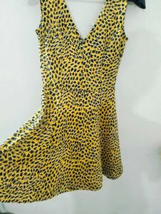H&amp;M yellow and Black animal print skater dress.