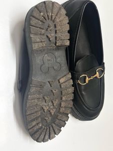 Black Loafers with Gold Detail