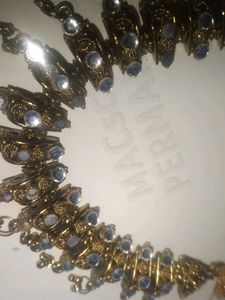 a golden colour necklace