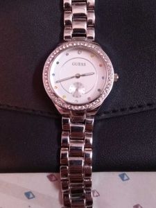 black clutch and guess watch