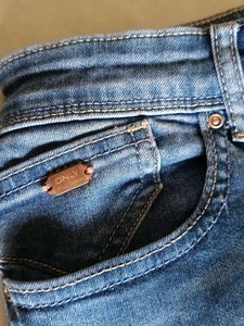 Distressed Blue Denim Jeans