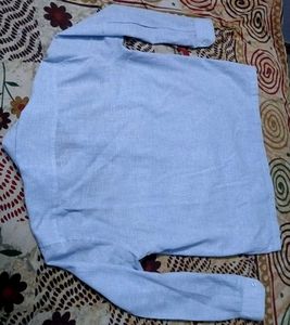 I am selling a formal light blue men's shirt.