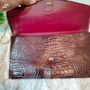 maroon vintage leather snakeprint bag
