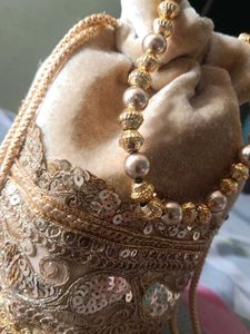 Elegant Gold Embellished Potli Bag