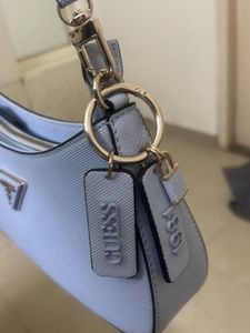 GUESS Women Solid Half Moon Fringed Shoulder bag