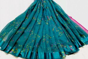 Graceful Teal Green Saree with Floral Design
