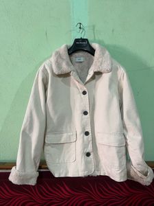 beige jacket with a faux fur collar and cuffs.