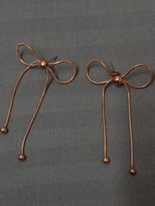 Golden Whisper – Elegant Bow Drop Earrings