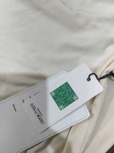 Elegant Cream Dress with Tie Detail From Newme