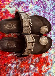 Elegant Black Ethnic Sandals with Ornate Silver Em