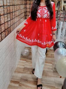A beautiful red chikankari short kurti