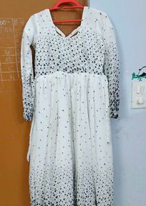 White frock with black dots design..