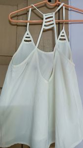 White sleeveless top