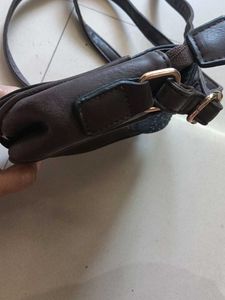 blue and dark brown sling bag