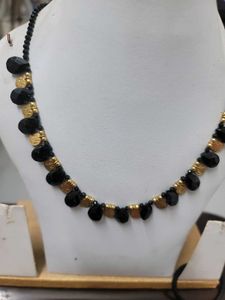 Black Beads With Gold Bead