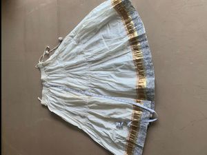 Fix price cream and golden skirt