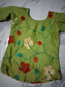 Green Embroidered short kurta top.