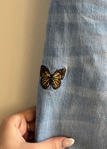Ripped Denim Jeans with Butterfly Embroidery