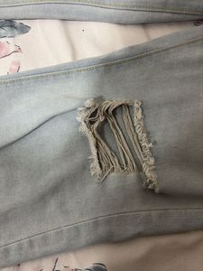 Distressed Light Wash Denim Jeans