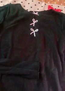 A Black Crop Top With Cute Pink Bow