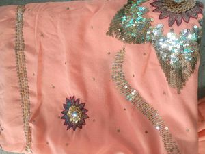 Peach colour saree with blouse and peticoat