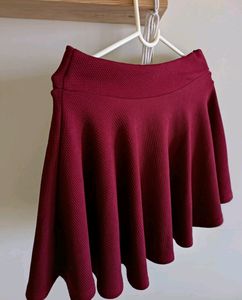 Flared mini skirt in maroon colour
