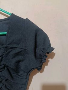 A Ruffled Black Crop Top