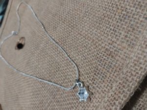 silver color pendant chain and rose gold chai