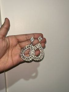 Diamond earrings with black beaded bracelet