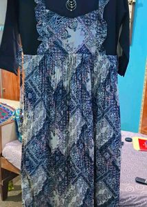 Patterned Dress with Unique Brooch