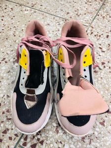 Well-loved Pink Sneakers