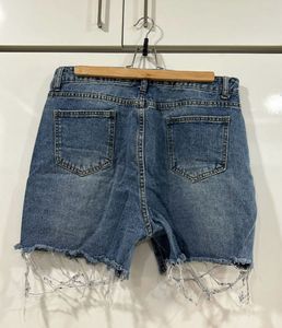 Blue ripped shorts