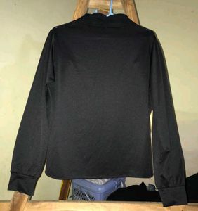 Elegant black pleated top.