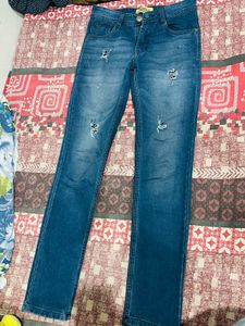Distressed Blue Denim Jeans