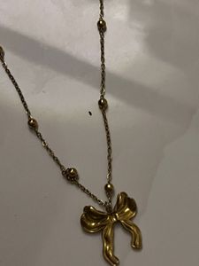 Gold Tone Bow Pendant Necklace
