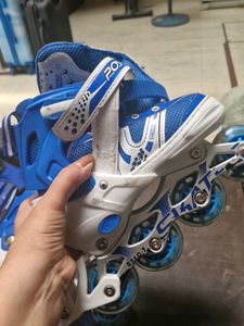 Blue and White Roller Blades