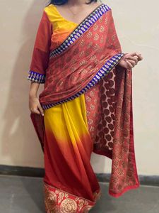 YELLOW ORANGE SHIFFON AND HEAVY EMBROIDERY SAREE