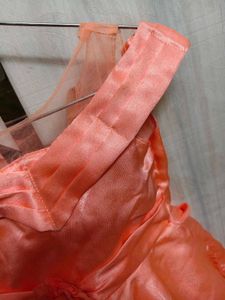 Beautiful shine frock with net shoulder cutoff