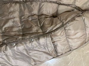 Light gold puffer jacket from Mango