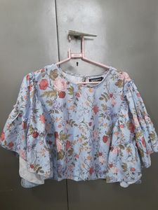 This is a Top From Sassafras . It Is Blue In Colour With Floral Print On It . Sixe Is XL