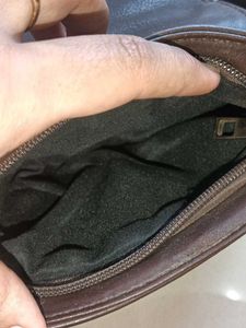 blue and dark brown sling bag