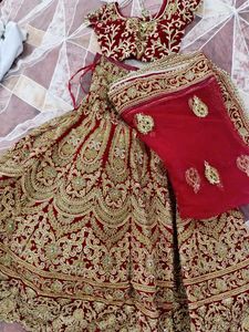 Red Bridal Lehenga With Beautiful Golden Work