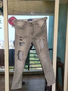 Highly Distressed Jeans In Grey
