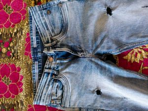 Distressed Blue Denim Jeans