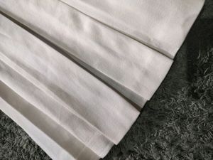 Knee Length White Pleated Skirt